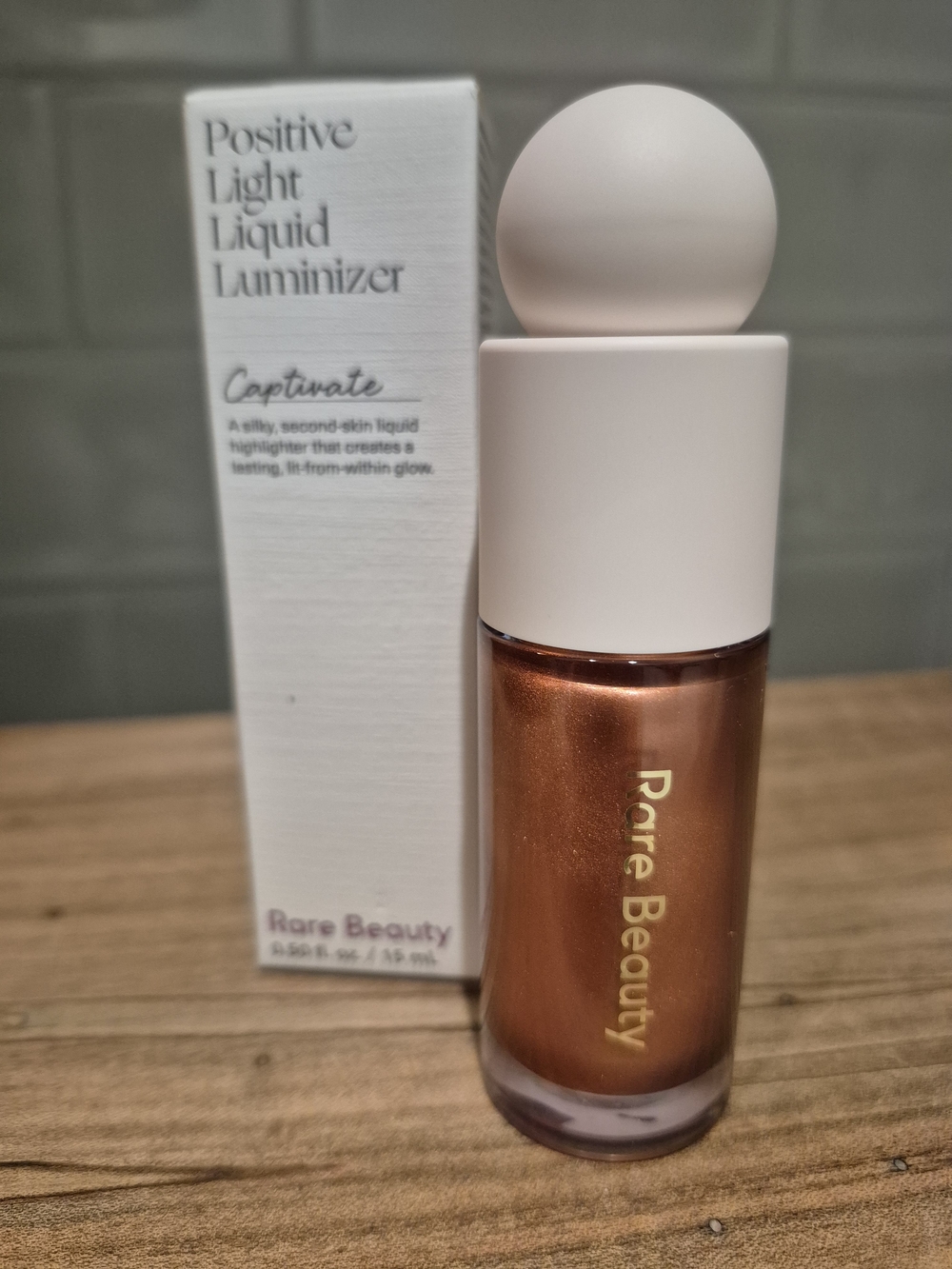 Rare Beauty Positive Light Liquid Highlighter Luminizer, Captivate Bronze